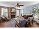 Inviting living room featuring a stone fireplace, hardwood floors, comfortable seating, and natural light at 80 Ingle View Ct, Burlington, NC 27215