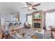 Open living room features a stone fireplace, bar seating, and ample natural light at 80 Ingle View Ct, Burlington, NC 27215