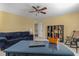 The room is brightly lit with a comfortable couch, providing a welcoming space for relaxation and work at 80 Ingle View Ct, Burlington, NC 27215