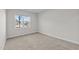 Bedroom showcasing neutral carpet, white walls, and natural light from a window at 978 Gateway Commons Cir, Wake Forest, NC 27587