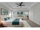 The main bedroom boasts a tray ceiling, dual windows, ample space, and soothing décor at 978 Gateway Commons Cir, Wake Forest, NC 27587