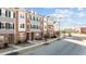 Street view showing a row of townhomes, sidewalks, and street at 978 Gateway Commons Cir, Wake Forest, NC 27587
