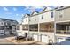 View of townhome-style condos with covered patio and attached garages at 978 Gateway Commons Cir, Wake Forest, NC 27587