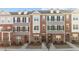 Townhome exterior showing brick facade, gray siding, and black shutters at 978 Gateway Commons Cir, Wake Forest, NC 27587