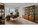 Bright office space with wood desk and shelving, and neutral carpet at 978 Gateway Commons Cir, Wake Forest, NC 27587