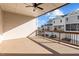 Spacious covered patio with ceiling fan and wooden railing offers outdoor living space at 978 Gateway Commons Cir, Wake Forest, NC 27587