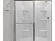Modern walk-in shower with glass doors and white interior at 978 Gateway Commons Cir, Wake Forest, NC 27587