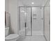 Glass shower with bench and shampoo niches offer a luxurious spa-like experience in this bathroom at 978 Gateway Commons Cir, Wake Forest, NC 27587