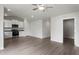 Open-concept living space featuring luxury vinyl plank flooring, recessed lighting and modern kitchen at 103 Flue Ct, Oxford, NC 27565