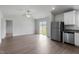 An open concept living room with a stainless steel refrigerator and sliding door to the backyard at 103 Flue Ct, Oxford, NC 27565
