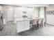 Bright, modern kitchen with white cabinets, a large center island, and stainless steel appliances at 1032 Country Pasture Cv, Wendell, NC 27591
