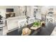 Open concept living space connecting the dining room, living room, and kitchen, creating a seamless flow at 1032 Country Pasture Cv, Wendell, NC 27591