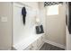 Functional mudroom features built-in bench with storage, hooks, and stylish decor at 1032 Country Pasture Cv, Wendell, NC 27591