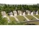 Aerial view of new homes in neighborhood with tree lined streets at 1032 Harper Rd, Raleigh, NC 27603