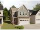 Charming two-story home with a 2-car garage and front yard at 1032 Harper Rd, Raleigh, NC 27603