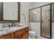 Bathroom showcasing a glass enclosed shower, granite counters and decorative mirror at 105 Jessfield Pl, Cary, NC 27519