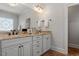 Bathroom featuring a large mirror, double sinks, and granite countertop at 105 Jessfield Pl, Cary, NC 27519