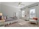 Well-lit bedroom featuring neutral walls, white trim, and a comfortable daybed at 105 Jessfield Pl, Cary, NC 27519