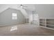 Bright bedroom features a vaulted ceiling with built-in shelves and natural light from the many windows at 105 Jessfield Pl, Cary, NC 27519