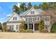 Beautiful two-story home featuring stone accents, a gabled roof, and a well-manicured front yard at 105 Jessfield Pl, Cary, NC 27519