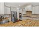 Modern kitchen with stainless steel appliances and granite countertops at 105 Jessfield Pl, Cary, NC 27519