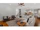 Open-concept living area with hardwood floors and a neutral color palette at 105 Jessfield Pl, Cary, NC 27519