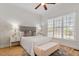 Bright bedroom with large window, ceiling fan, and a comfy sitting bench at 105 Jessfield Pl, Cary, NC 27519