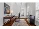 Well-lit home office with a modern desk, artwork, and plenty of natural light at 105 Jessfield Pl, Cary, NC 27519