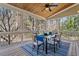 Relaxing screened porch with dining set, wood floors and ceiling, offering serene outdoor dining at 105 Jessfield Pl, Cary, NC 27519