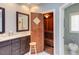 Bathroom features double vanity and adjoining sauna with wooden benches and door at 105 Wicklow Pl, Chapel Hill, NC 27517