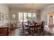 Elegant dining room with chandelier, hardwood floors and lots of natural light at 105 Wicklow Pl, Chapel Hill, NC 27517