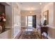 Welcoming foyer with hardwood floors, decorative rug, and elegant lighting at 105 Wicklow Pl, Chapel Hill, NC 27517