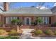 Elegant brick front entrance with well-maintained landscaping and inviting walkway at 105 Wicklow Pl, Chapel Hill, NC 27517