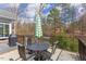 Deck with outdoor seating area, complete with table, chairs, and grill at 105 Wicklow Pl, Chapel Hill, NC 27517
