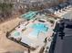 Aerial view of the community pool, bocce ball court, and tennis courts, showcasing the recreational facilities at 106 Ivory Ln, Raleigh, NC 27610