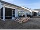 Well-maintained backyard with a patio, a grill, and a view of the screened-in porch at 106 Ivory Ln, Raleigh, NC 27610