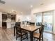 Open-concept dining area flowing into a modern kitchen and cozy living room, perfect for entertaining at 106 Ivory Ln, Raleigh, NC 27610