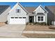 Charming single-Gathering home with a well-manicured lawn and an attached two-car garage at 106 Ivory Ln, Raleigh, NC 27610