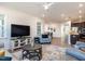 Open living room features modern decor, comfortable seating, stylish rug, and views into kitchen at 106 Ivory Ln, Raleigh, NC 27610