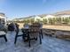 Outdoor patio area featuring a built-in stone wall, patio furniture, and a BBQ grill at 106 Ivory Ln, Raleigh, NC 27610