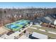 A high-angle perspective of well-maintained tennis and bocce ball courts, surrounded by lush landscaping at 106 Ivory Ln, Raleigh, NC 27610