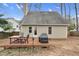 Backyard with deck and outdoor dining set, perfect for enjoying the serene outdoor setting at 107 Fishers Creek Ct, Cary, NC 27513