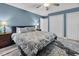 Calm bedroom with a ceiling fan and hardwood floors, ample closet space, and two bedside tables at 107 Fishers Creek Ct, Cary, NC 27513