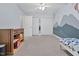 Bedroom with a decorative blue wall, a closet, and a bed at 107 Fishers Creek Ct, Cary, NC 27513