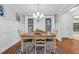 Well-lit dining room with white wainscoting, a light fixture, and view to the outdoors at 107 Fishers Creek Ct, Cary, NC 27513