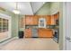 This is a kitchen with stainless steel appliances and tan cabinetry at 107 Fishers Creek Ct, Cary, NC 27513