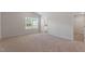 Spacious bedroom with plush carpeting and natural light at 107 Scoville St, Oxford, NC 27565