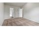 Carpeted bedroom with two entry doors and fresh neutral paint throughout at 108 Hybrid St, Oxford, NC 27565