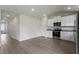 Modern kitchen featuring stainless steel appliances and sleek white cabinetry at 108 Hybrid St, Oxford, NC 27565