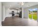 Open floor plan with stainless steel appliances, an eat-in kitchen, and sliding glass doors at 108 Hybrid St, Oxford, NC 27565